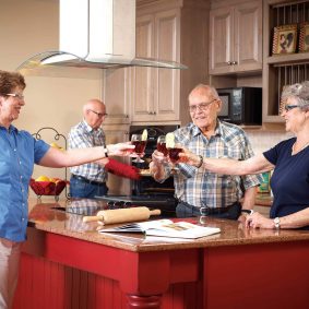 Seasons reisdents gathering and smiling while enjoying a drink